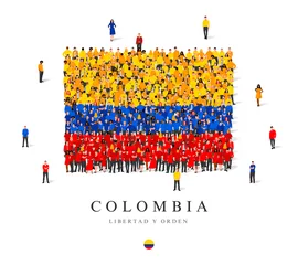 Fototapeten A large group of people are standing in yellow, blue and red robes, symbolizing the flag of Colombia. © chekart