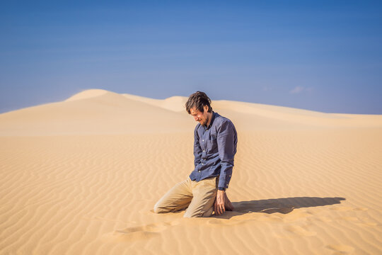 Exhausted man in the desert. Apathy, fatigue, exhaustion, mental disorders concept. Mental health