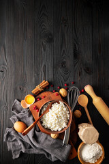 ingredients for making curd casserole on wooden background, top view, copy space