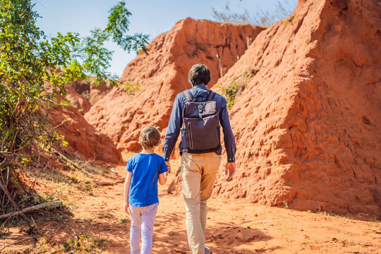 Dad and son tourists in red canyon, resumption of tourism concept. Traveling with children concept