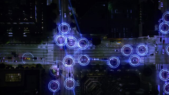 Autonomous self driving cars moving through city. Concept: artificial intelligence scans vehicles and pedestrians, internet of things, surveillance system. Night time.