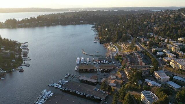 Cinematic aerial drone dolly footage of Meydenbauer Bay Park, Clyde, Eastland, beach park, marinas with Lake Washington Whalers Cove waterfront mansions in Belleview near Seattle, Washington