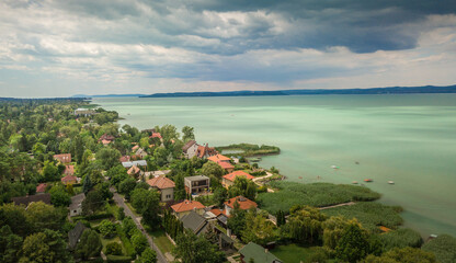 Aerial view of green water of Lake Balaton popular summer vacation spot at Balatonszeplak and...