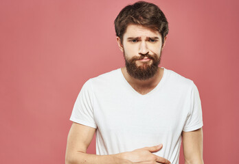 Fototapeta premium Man portrait white t-shirt pink background model bushy beard brunette