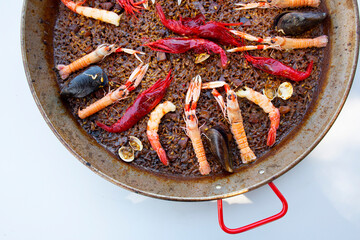 Traditional seafood paella in the fry pan