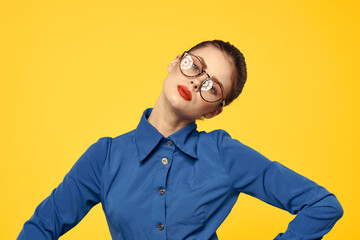 Cheerful woman elegant style glasses smile red lips yellow background