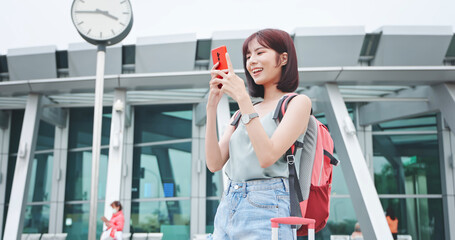 Asian traveler use smartphone