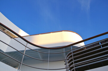 Luxury sun loungers and deck lounge chairs on outside terrace, patio or balcony sun pool deck of...