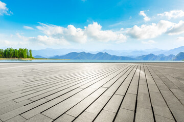 Obraz premium Empty square floor and mountain with lake landscape under the blue sky.