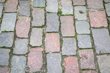 Historical and ancient stone pavement. Sidewalk and carriageway