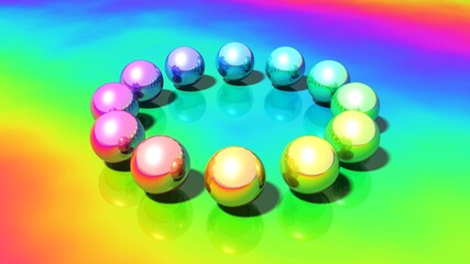 eine Gruppe bunter Metallkugeln auf einem glänzenden Hintergrund im vollen Farbspektrum
