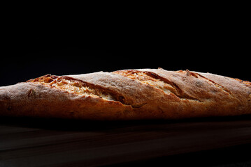Baguette close-up. Baguette side view. Art bread.