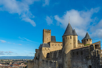 Fototapeta na wymiar View to the historical castle carcassone - cite de carcassone - with the towers, background blue sky