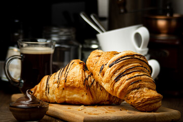 fresh croissants with coffee and chocolate