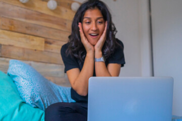 Young indian woman using a laptop
