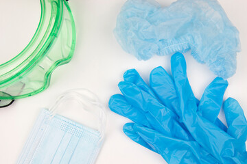 Fototapeta premium protective clothing set for the doctor. medical gloves, mask, glasses, hat.