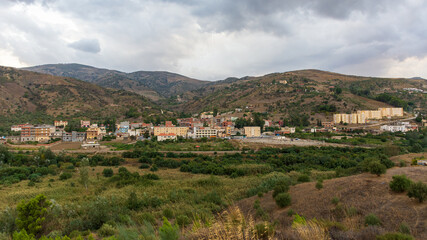Fototapeta na wymiar Panoramic view of a small village between the mountains 