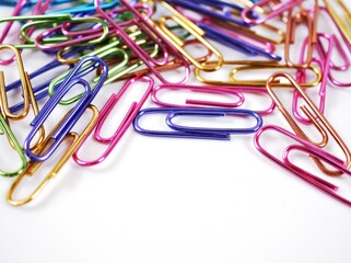 Paper clip, metal shiny colorful isolated on white background