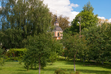 Naklejka premium Monastic garden in the Staritsky Svyato-Uspenskiy Monastery in city Staritsa, Tver region