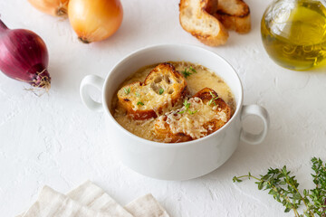 French onion soup with toasts and cheese. French cuisine. Vegetarian food.