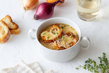 French onion soup with toasts and cheese. French cuisine. Vegetarian food.