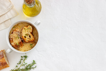 French onion soup with toasts and cheese. French cuisine. Vegetarian food.