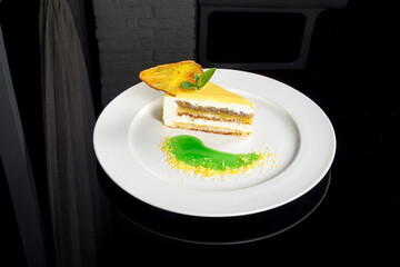 Pear cheesecake on a white plate filmed with reflection