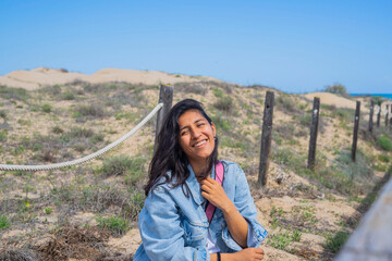 Young Indian woman happy in beach 
