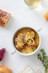 French onion soup with toasts and cheese. French cuisine. Vegetarian food.