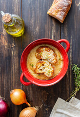 French onion soup with toasts and cheese. French cuisine. Vegetarian food.