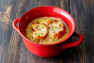 French onion soup with toasts and cheese. French cuisine. Vegetarian food.