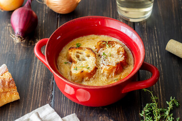French onion soup with toasts and cheese. French cuisine. Vegetarian food.