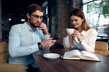 young couple in cafe work colleagues breakfast lifestyle
