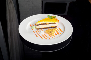 One slice of fruit cheesecake on a white plate