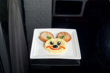 Photo for the children's menu dish face from potatoes and cutlets