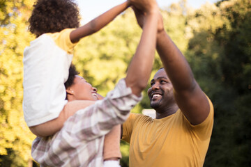 African American family having fun outdoors.