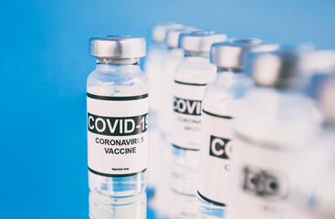 Covid-19 coronavirus vaccine on the blue background