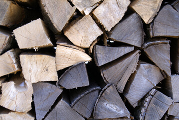 Fototapeta premium Stapled firewood at border of rural road. Photo taken April 8th, 2021, Hinwil, Switzerland.