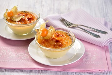 Creme brulee served with physalis