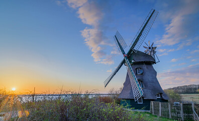 Sunset at the windmill Charlotte in Geltinger Birk, nature reserve Schleswig Holstein, Nieby, Germany. © snapshotfreddy