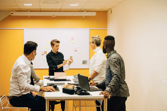 Business people discussing at conference table in board room