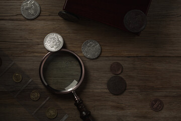 Numismatics. Old collectible coins of silver, gold and copper on the table.