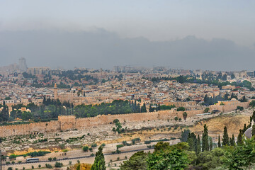Fototapeta na wymiar Panorama of the old city Jerusalem and monumental defensive walls. World holy places in Israel
