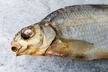 Dried salted fish on a concrete background. Homemade food, beer snack. High quality photo
