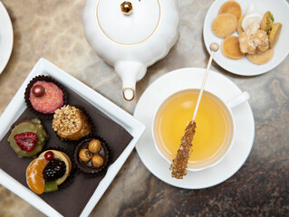 selective focus. Tea time with cake and cookies and cane sugar . Breakfast time. 