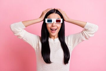 Photo of young amazed smiling positive girl in 3d glasses watch exciting film in cinema isolated on pink color background