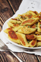 Polish dish kopytka served at the table