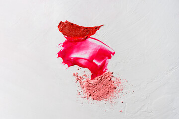 Composition of decorative cosmetic smears - lipstick, lip gloss, face powder on white