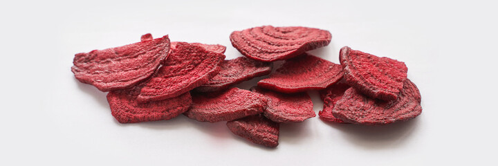 Crispy dried food. Organic tasty chips. Homemade snacks. Sliced beetfood. Healthy vegetables