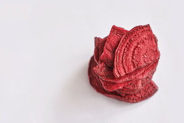 Crispy dried food. Organic tasty chips. Homemade snacks. Sliced beetfood. Healthy vegetables